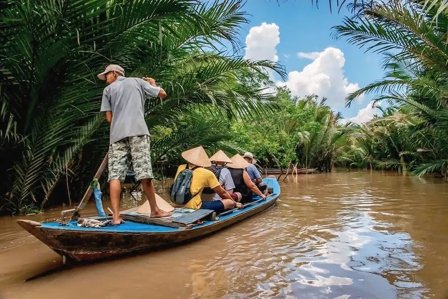 Authentic Mekong Delta Tour 1 Day through peaceful palm-lined waterways