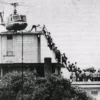 Iconic 1975 helicopter evacuation from the rooftop of 22 Ly Tu Trong Street in Saigon, a pivotal historical site visited on our private motorbike tour.