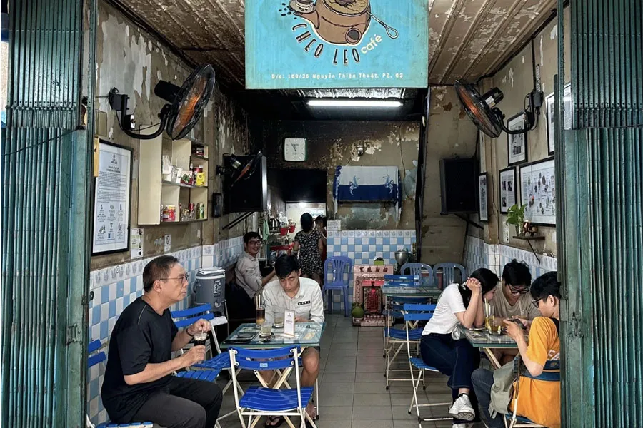 A peaceful hidden alley in Nguyen Thien Thuat where locals enjoy traditional cloth-filter coffee