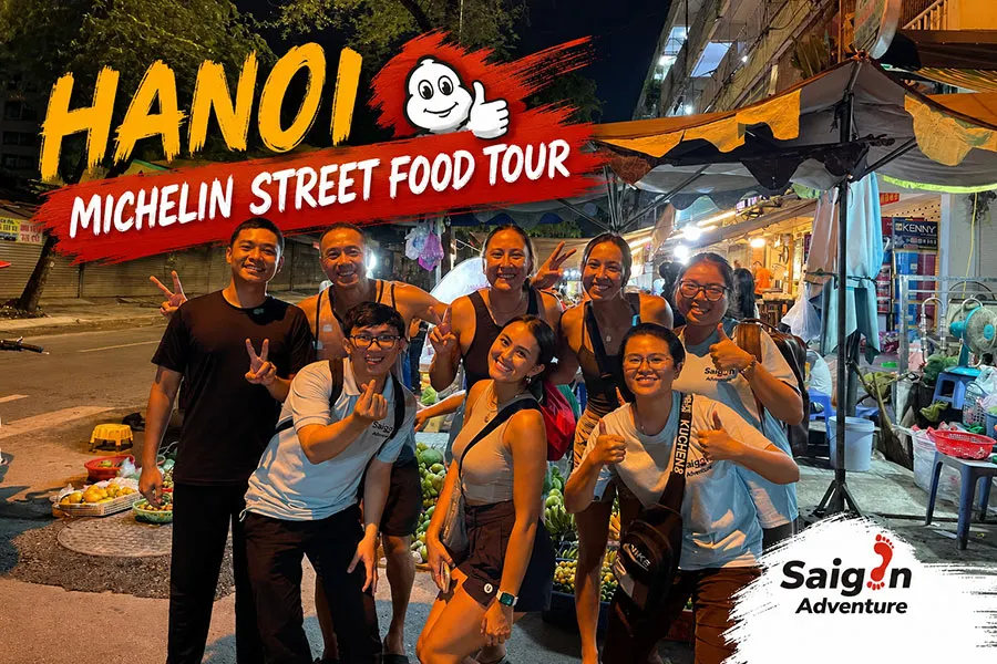 Hanoi Michelin Street Food Tour with food enthusiasts enjoying traditional Vietnamese meals