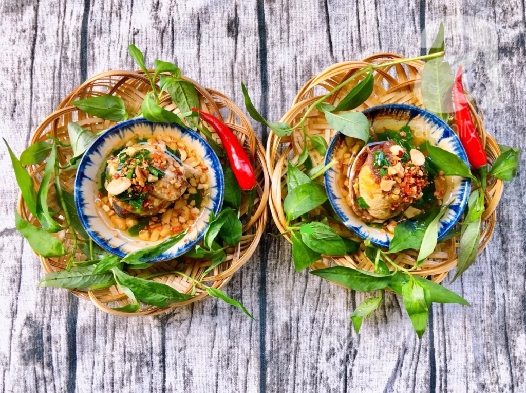 a popular Vietnamese street food snack: Grilled Balut with Scallion Oil (Trứng Vịt Lộn Nướng Mỡ Hành).