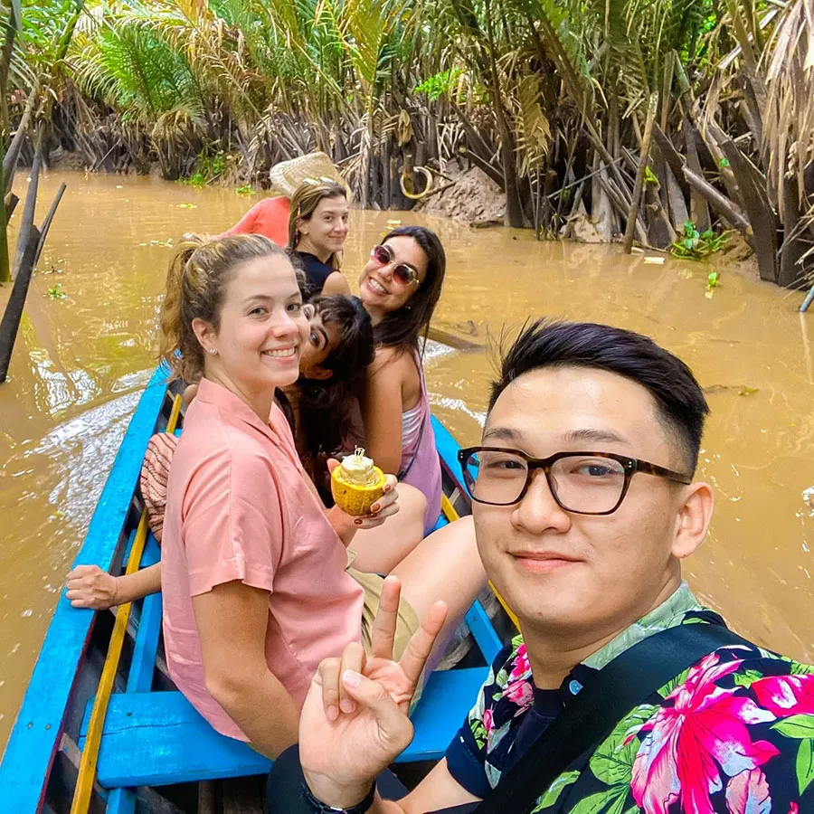 Peaceful coconut-lined canals during a Mekong Delta boat tour