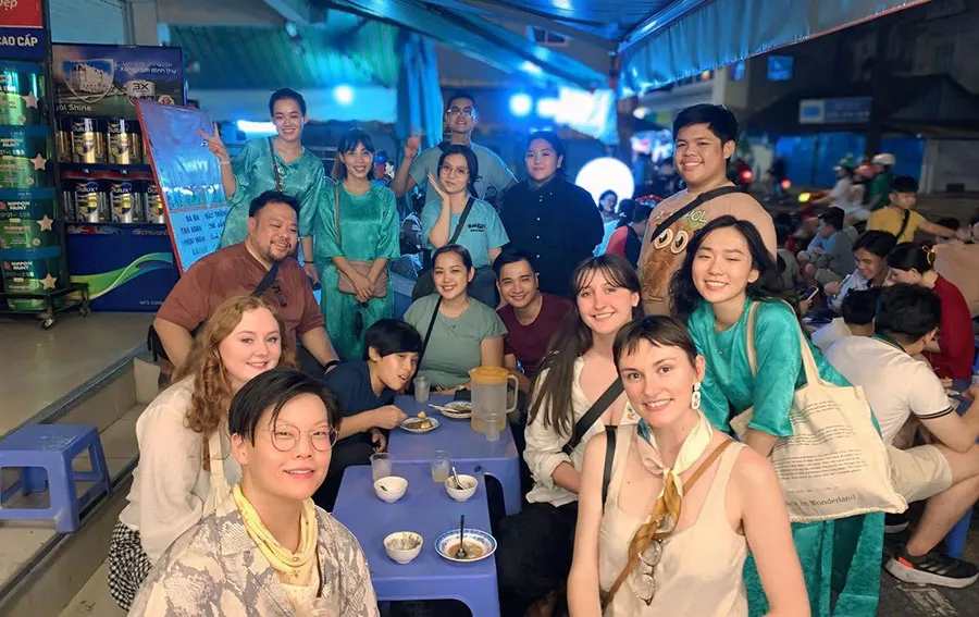Group of tourists enjoying a memorable Saigon Food Tour in Ho Chi Minh City