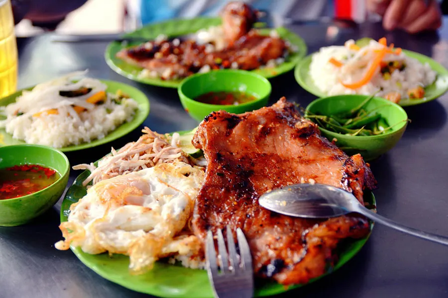 What Do Vietnamese People Eat for Lunch? A Local Food Guide 8 Best com tam in Ho Chi Minh City with grilled pork chop, broken rice, egg meatloaf and pickled vegetables