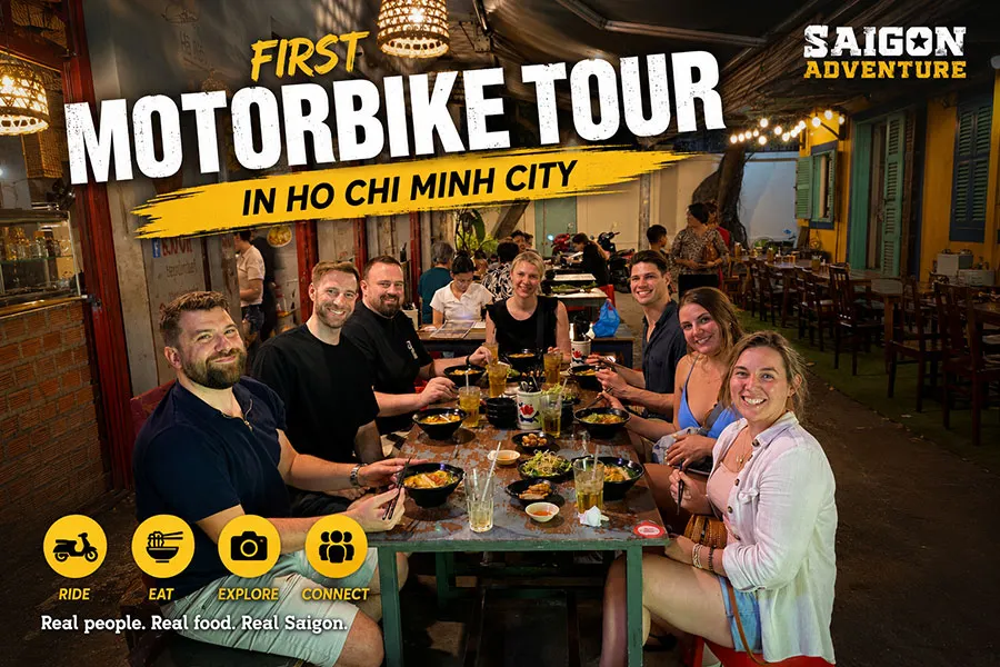 First motorbike tour in Ho Chi Minh City with tourists enjoying authentic Vietnamese street food