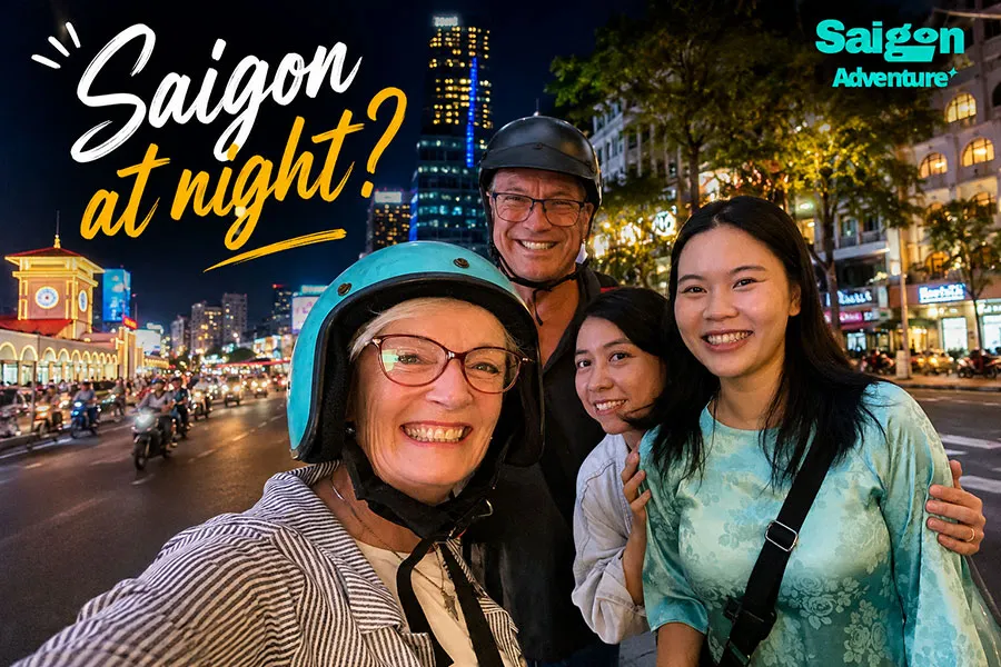 Visitors enjoying a night scooter adventure through the lively streets of Saigon.