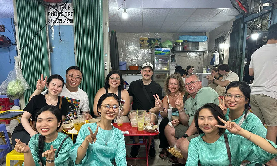 Enjoy a refreshing glass of freshly pressed Vietnamese sugarcane juice during a local food tour