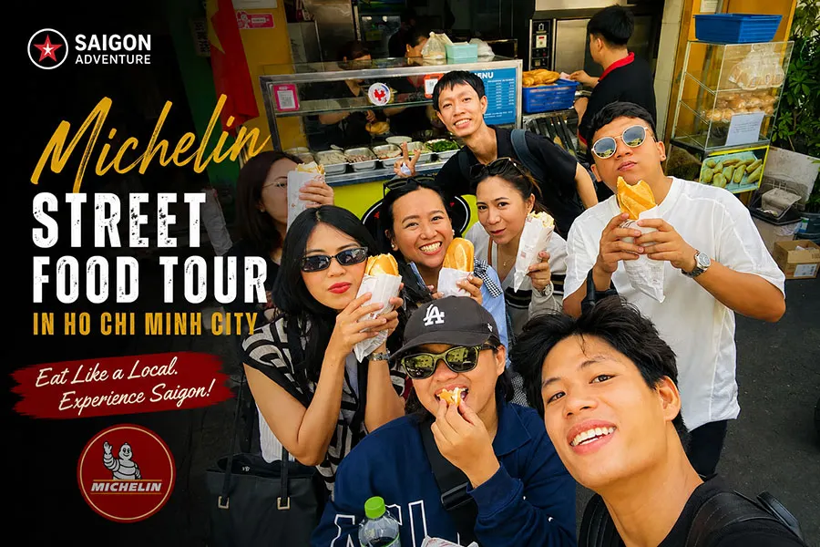 Tourists tasting Michelin-recommended street food during a Saigon food tour