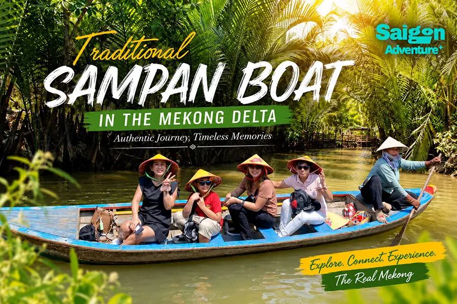 Traditional Sampan Boat in the Mekong Delta: Is It Worth It? Full Guide for First-Time Visitors 2 Traditional sampan boat tour through the lush Mekong Delta canals with smiling travelers enjoying an authentic Vietnam river adventure.