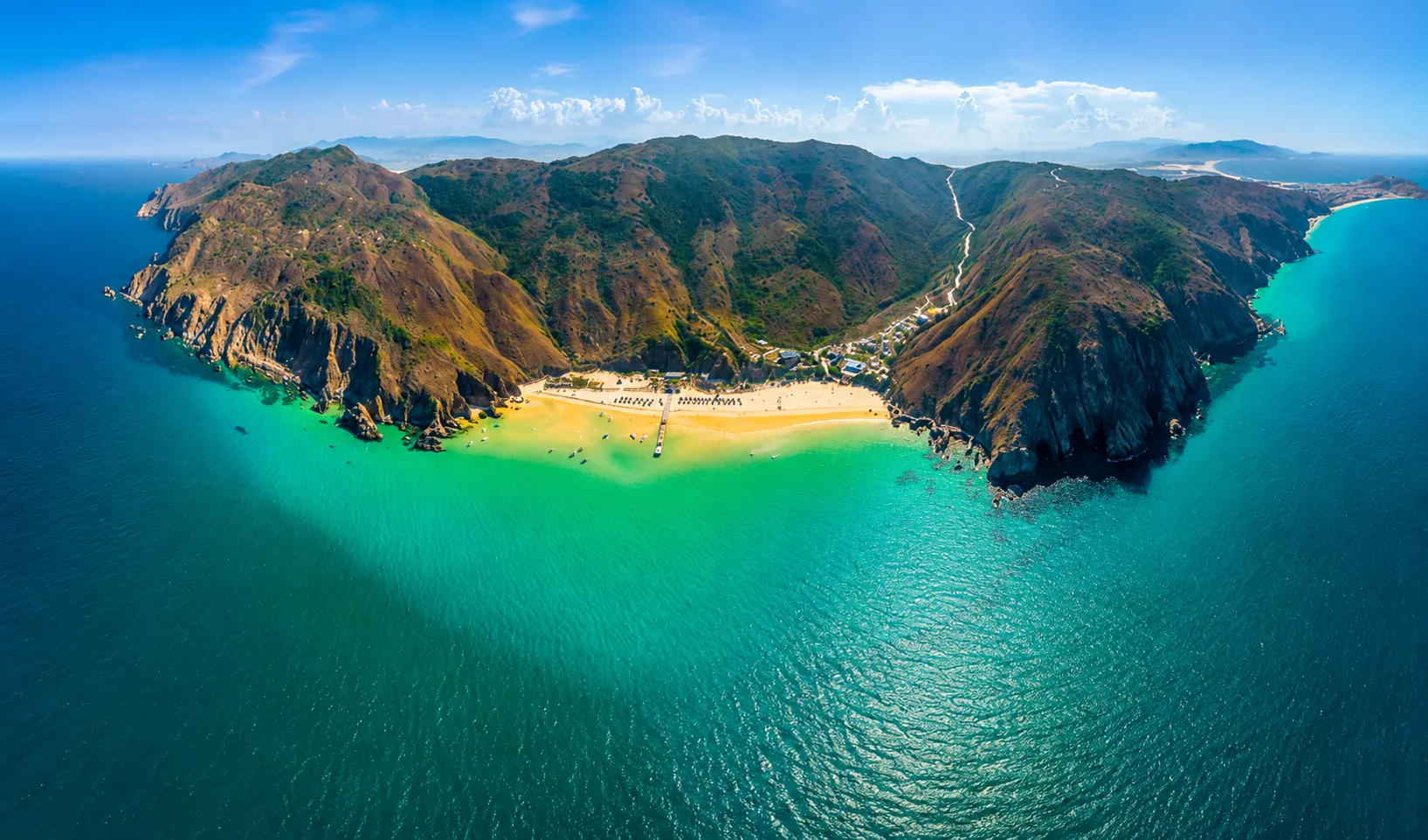Ky Co Beach in Quy Nhon with turquoise water, white sandy beach, dramatic cliffs, and one of Vietnam's best coastal landscapes