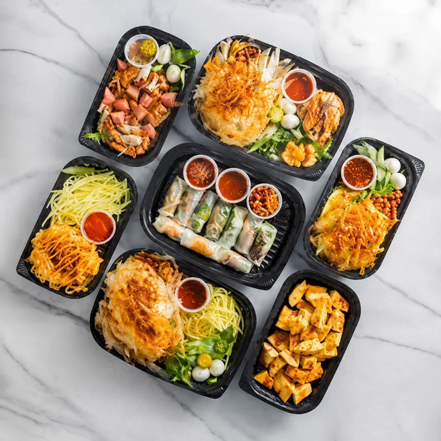 Is Street Food in Ho Chi Minh City Spicy? 6 Bánh tráng trộn street snack in Saigon with savory toppings, fresh herbs, peanuts and adjustable chili