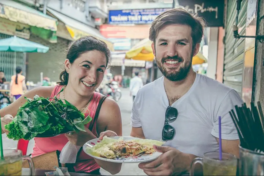 What to Eat in Ho Chi Minh City Besides Pho and Banh Mi? 6 Authentic Vietnamese street food experience with banh xeo in Ho Chi Minh City.