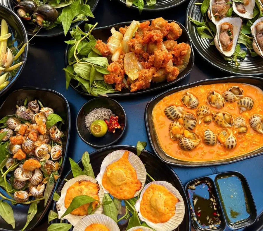 10 Best Vietnamese Snail Dishes to Try in Ho Chi Minh City 2 Authentic Saigon snail food featuring grilled shellfish, rich sauces, herbs and Vietnamese street food flavors