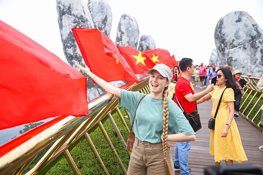 What Is It Like to Visit the Golden Bridge During Vietnam National Day? 1 Tourists walking across the Golden Bridge at Ba Na Hills during Vietnam’s National Day celebrations