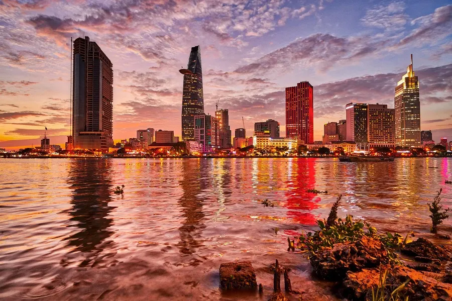 Is the Saigon River Beautiful? What You Can See from the Water 1 Saigon River at sunset with Ho Chi Minh City skyline reflected on the water