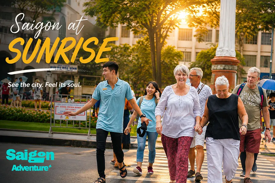 Saigon at Sunrise: 10 Best Things to Do Before 8 AM 1 Tour guide leading visitors through downtown Saigon during a beautiful sunrise