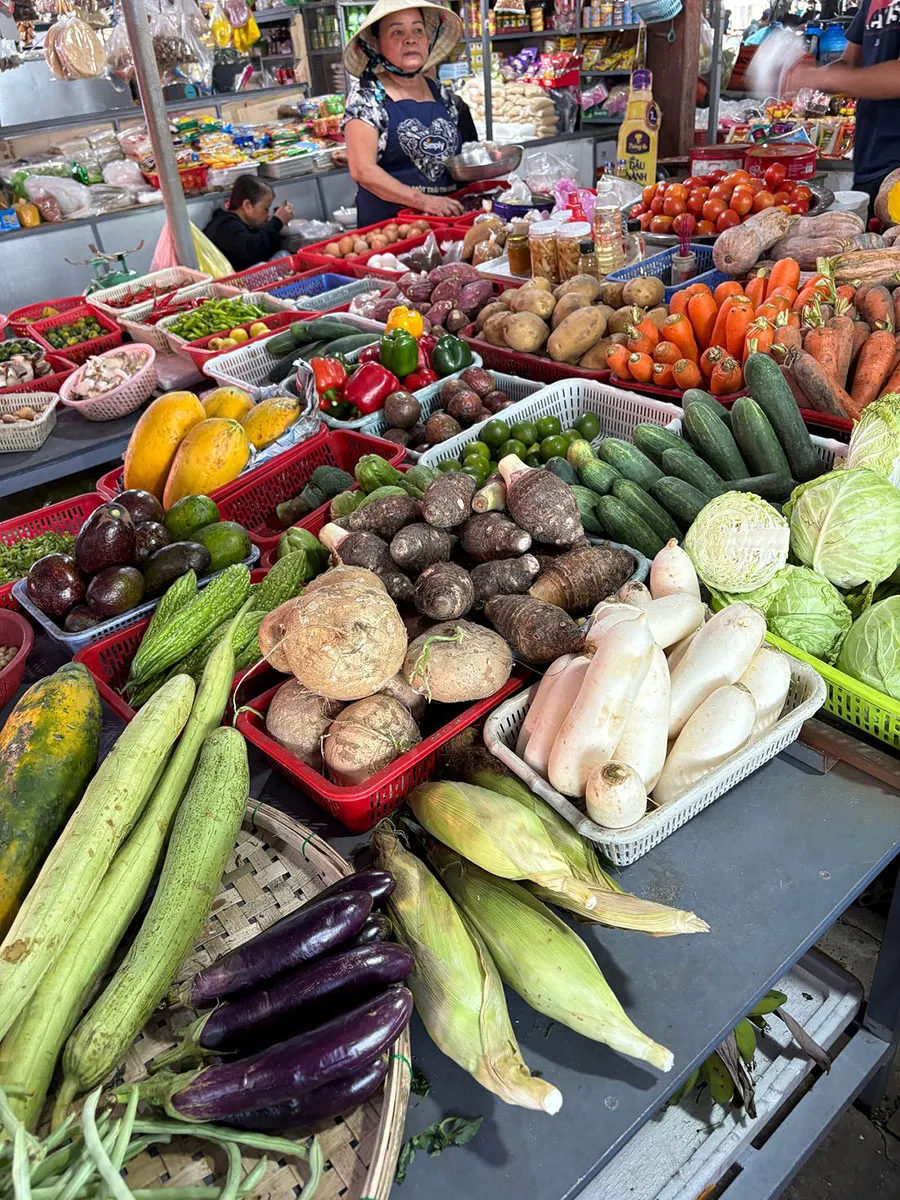 What Can Travelers Discover in Saigon’s Traditional Wet Markets? 4 Colorful fresh produce displayed at a traditional Saigon wet market