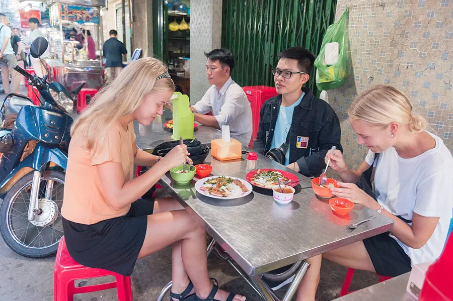 Saigon at Sunrise: 10 Best Things to Do Before 8 AM 3 Com tam breakfast with grilled pork, pickled vegetables and scallion oil