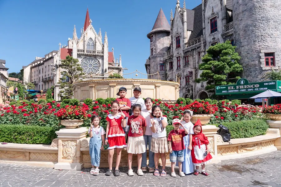 Ba Na Hills With Kids: A Practical Family Travel Guide 3 Children exploring Ba Na Hills attractions with their parents in Da Nang