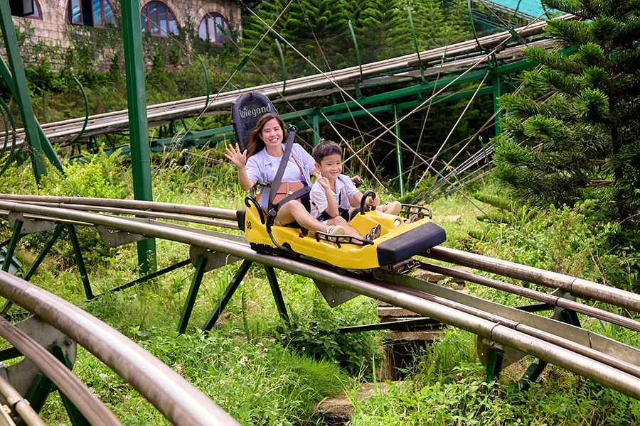 Ba Na Hills With Kids: A Practical Family Travel Guide 4 Children enjoying exciting rides during a fun family day at Ba Na Hills