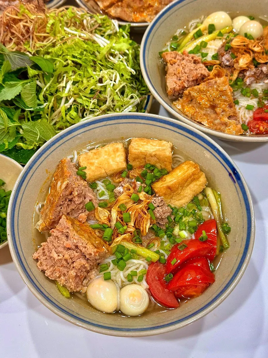 Best Vietnamese Noodle Soups in Ho Chi Minh City Besides Pho 2 Enjoy a delicious bowl of bún riêu with rich crab and tomato broth in Saigon