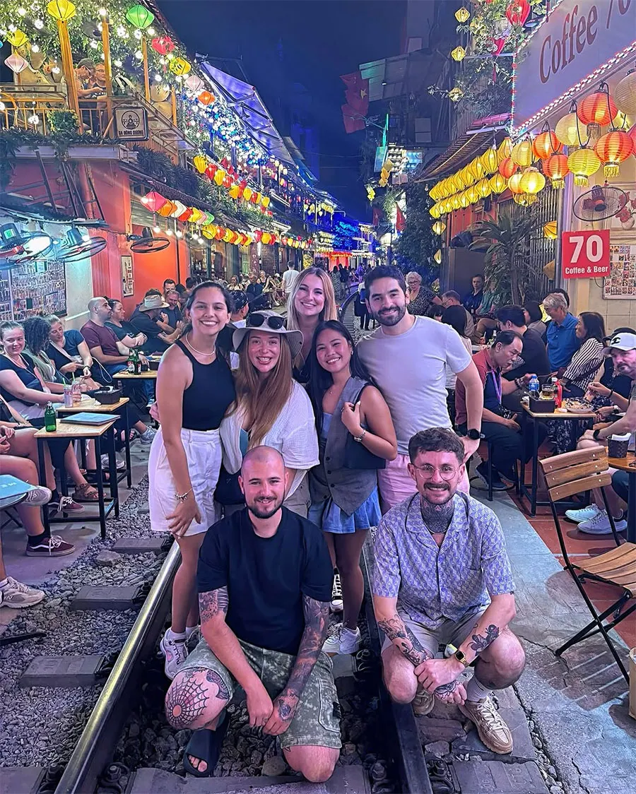 Hanoi Train Street Food Guide: What to Eat and Drink Near the Railway 8 Experience Hanoi Train Street with family and friends while sharing coffee and memorable moments beside the railway.