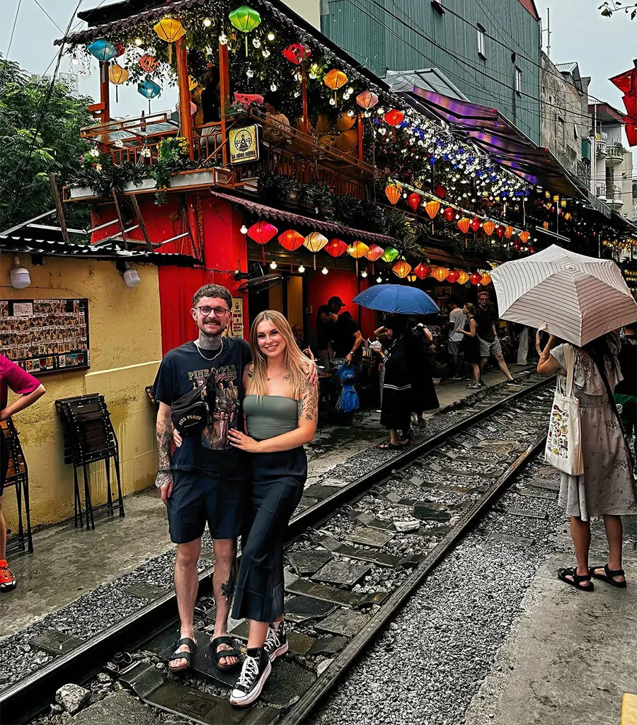 Is Hanoi Train Street Worth Visiting? An Honest Guide for First-Time Travelers 1 Travelers enjoying an exciting railway experience in the heart of Hanoi