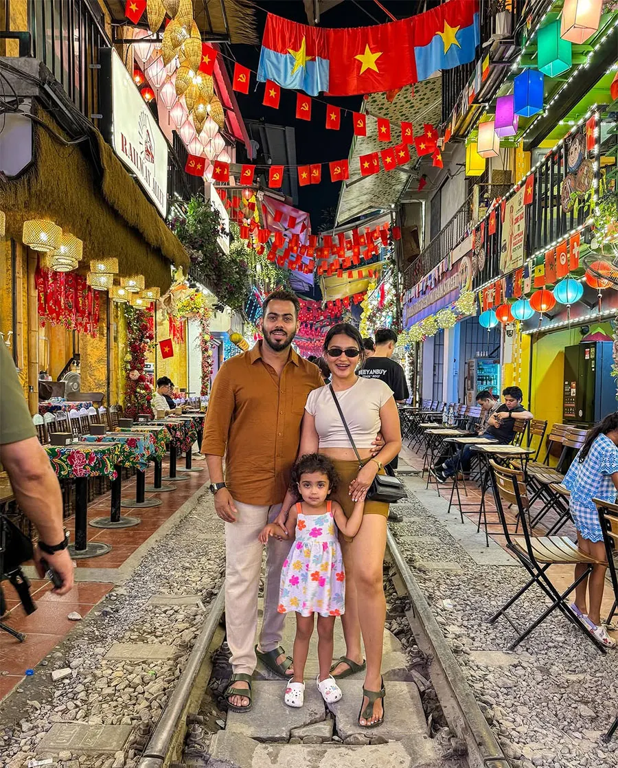 Is Hanoi Train Street Worth Visiting? An Honest Guide for First-Time Travelers 4 A family creating special travel memories at Hanoi Train Street