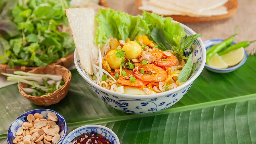 Da Nang Food at Night: What to Eat After Sunset 3 Enjoy a flavorful bowl of Mi Quang while exploring Da Nang food at night