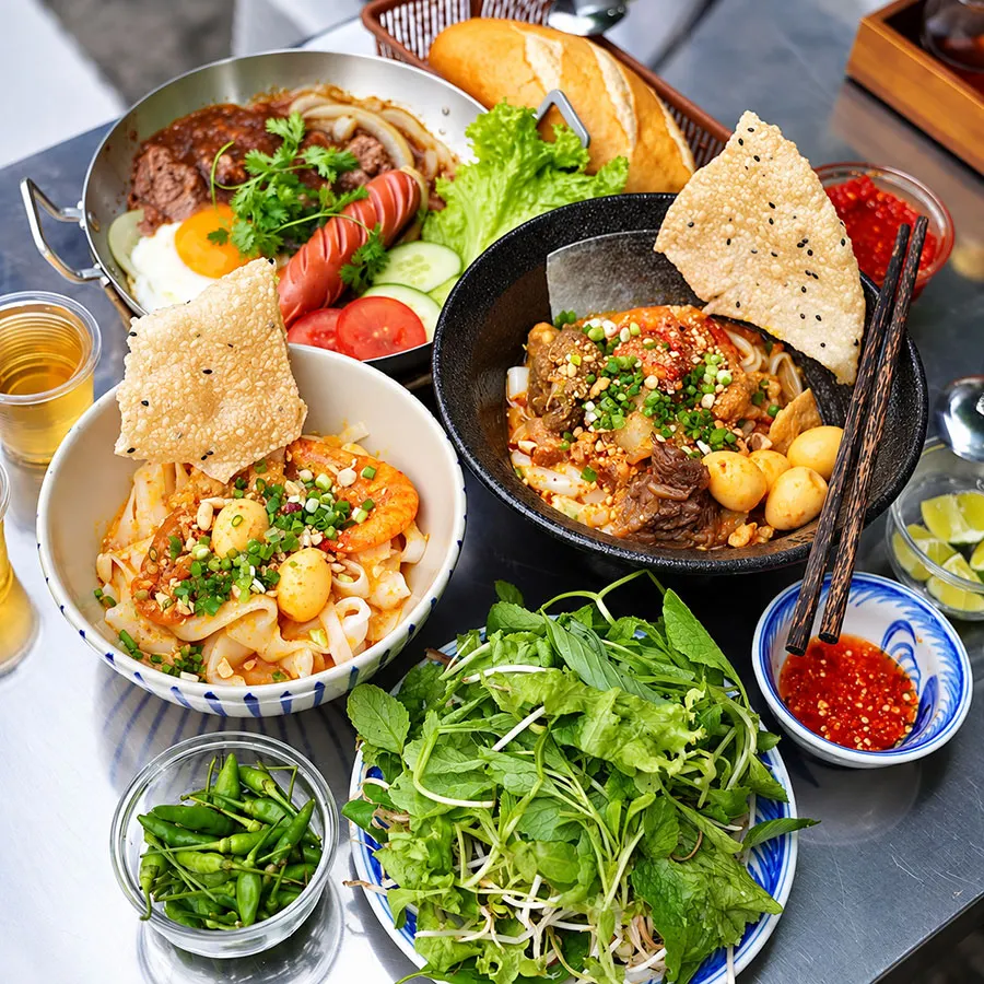 Mi Quang in Da Nang: How to Eat It Like a Local 2 Traditional Da Nang Mi Quang showing noodles, toppings and shallow broth