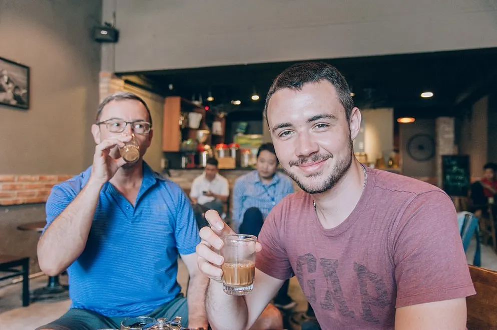Sidewalk Coffee in Ho Chi Minh City: A Local Guide to Saigon’s Street Café Culture 3 Joyful visitors enjoying street coffee and local atmosphere in Ho Chi Minh City