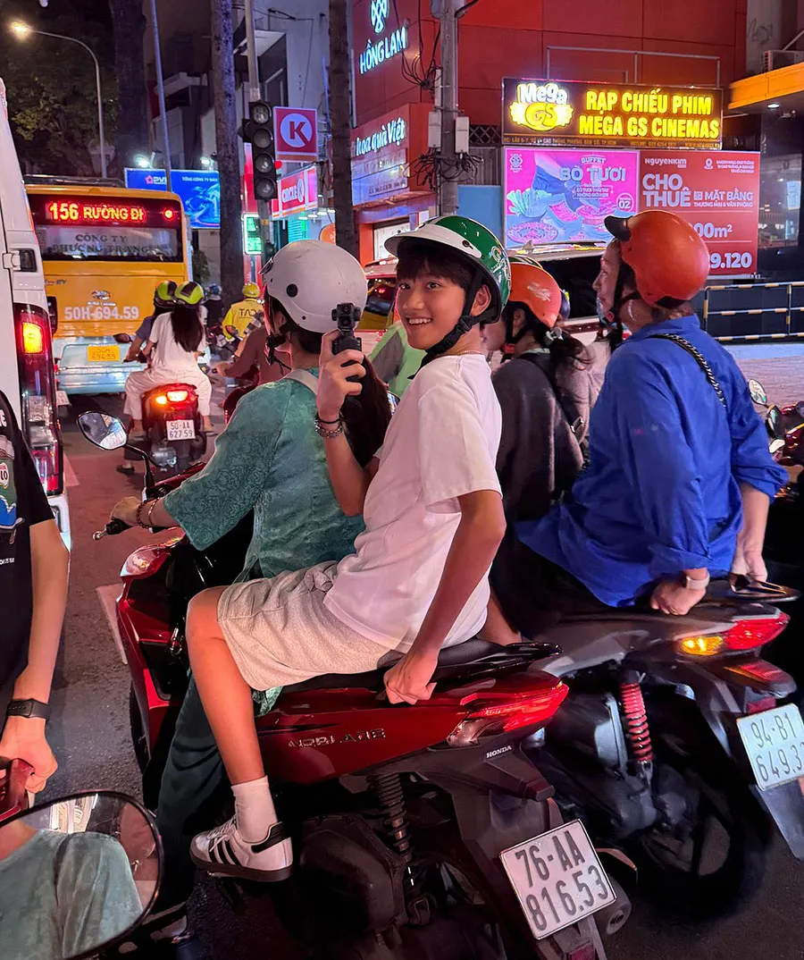 What to Do in Saigon If You’re Not Interested in Museums 4 International visitors enjoying a Saigon motorbike city tour through busy streets and local neighborhoods
