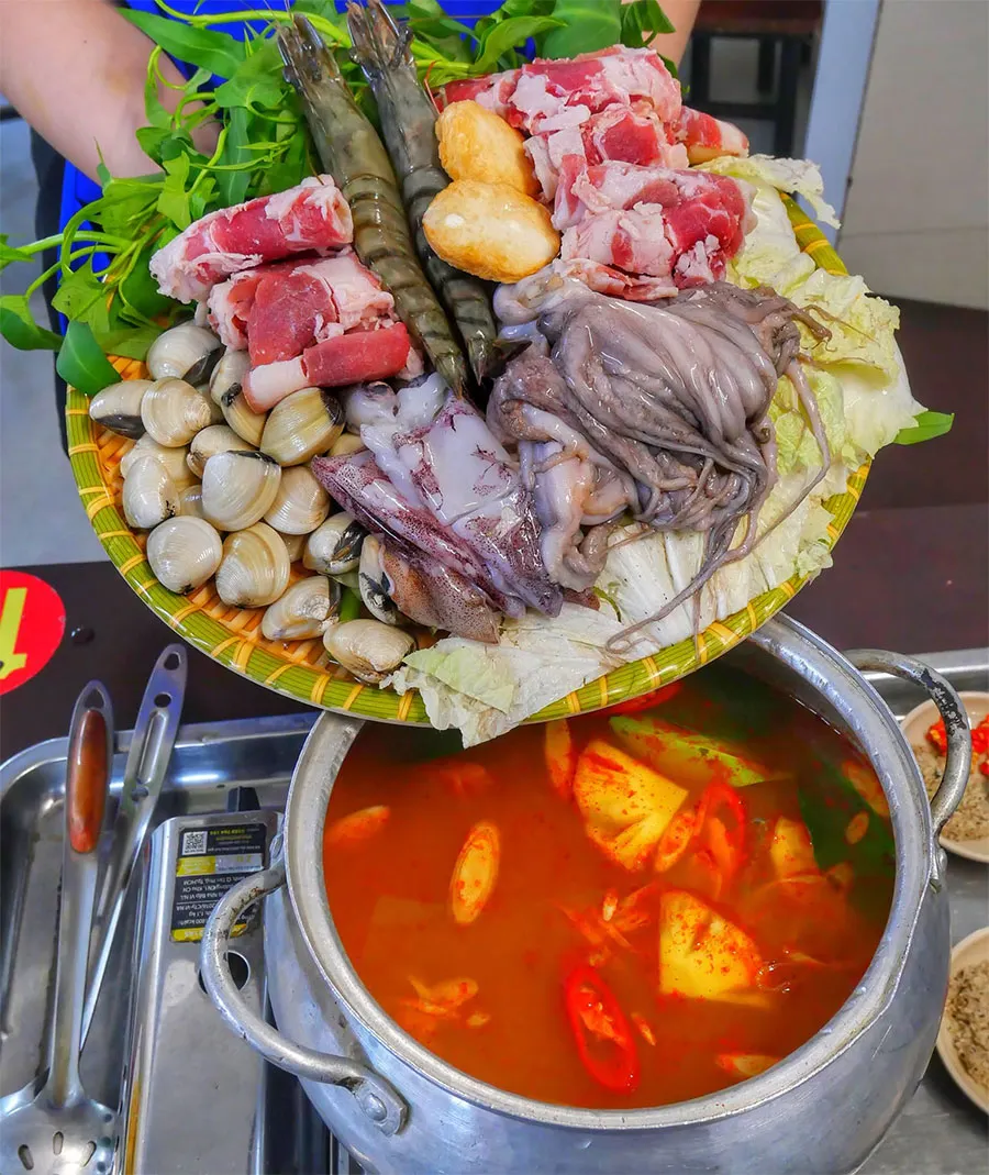 A Traveler’s Guide to Eating Vietnamese Hot Pot in Saigon 3 Steaming Vietnamese hot pot with fresh ingredients and a rich, fragrant broth — why not try it at least once when visiting Vietnam?