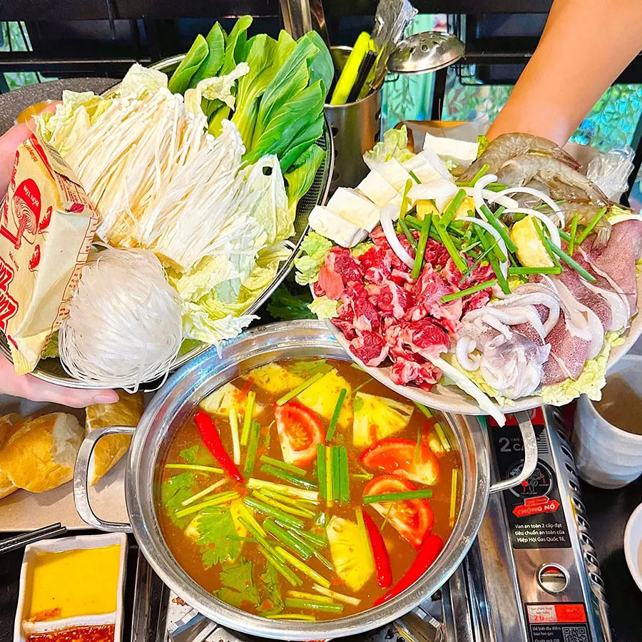 A Traveler’s Guide to Eating Vietnamese Hot Pot in Saigon 2 Vietnamese hot pot is a flavorful shared meal with fragrant broth, fresh ingredients and a warm atmosphere enjoyed with loved ones.