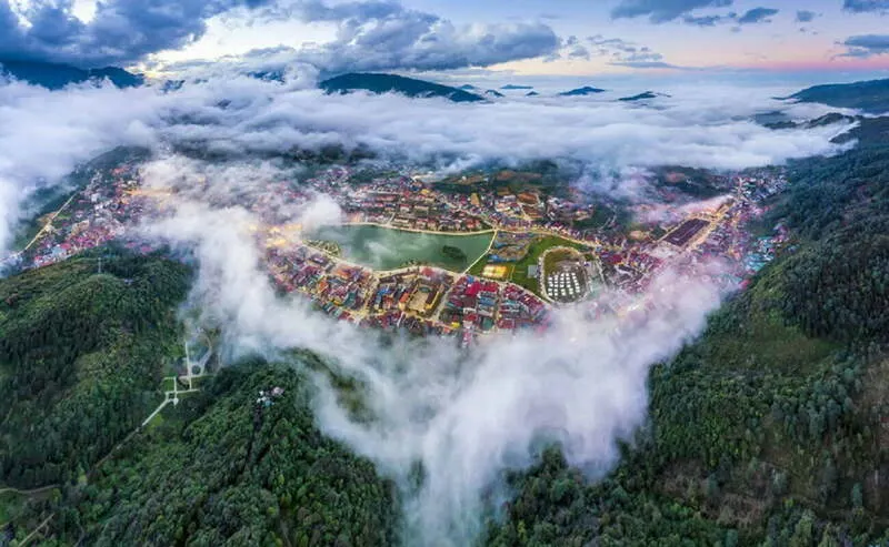 Sa Pa town surrounded by mountains and clouds in northern Vietnam