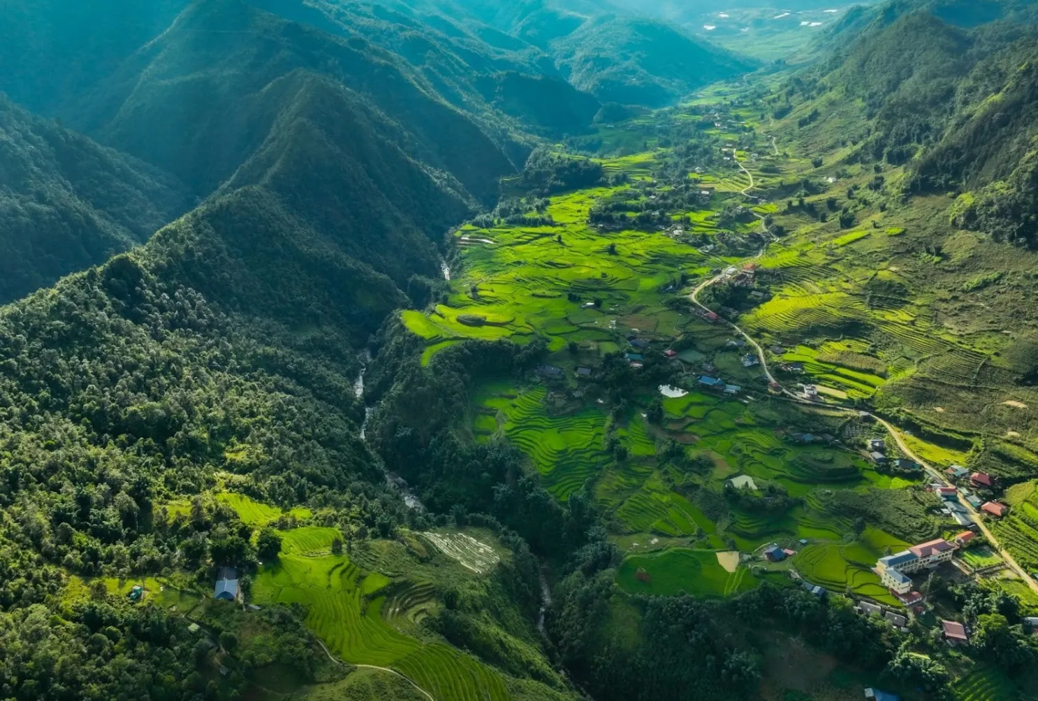 Local people walking through the mountain landscape near Sa Pa