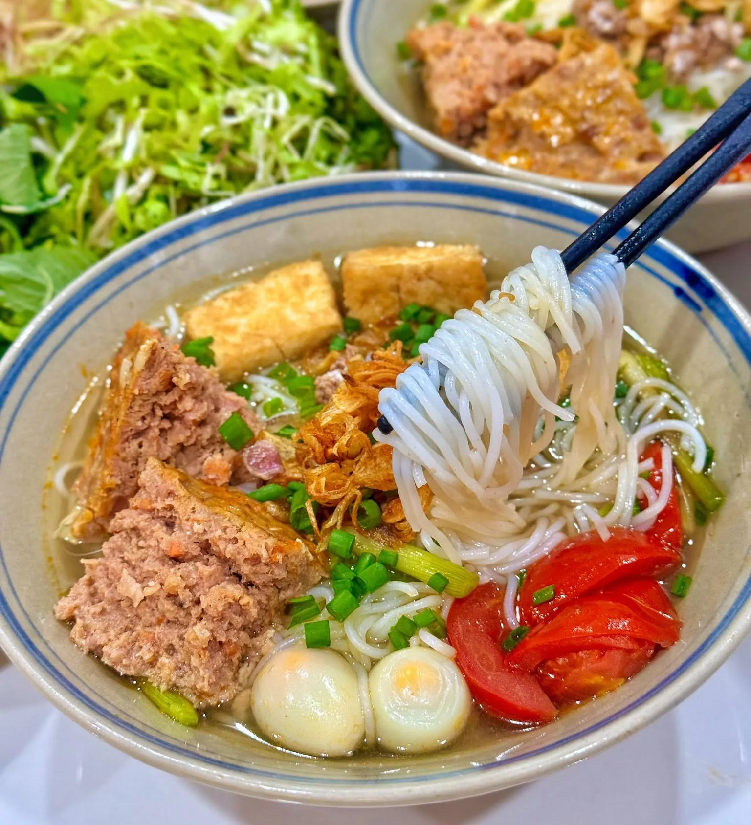 Bun Rieu for Beginners: What’s Inside the Bowl? 6 Fried tofu helps carry the rich flavors of crab, tomato and broth in bun rieu.