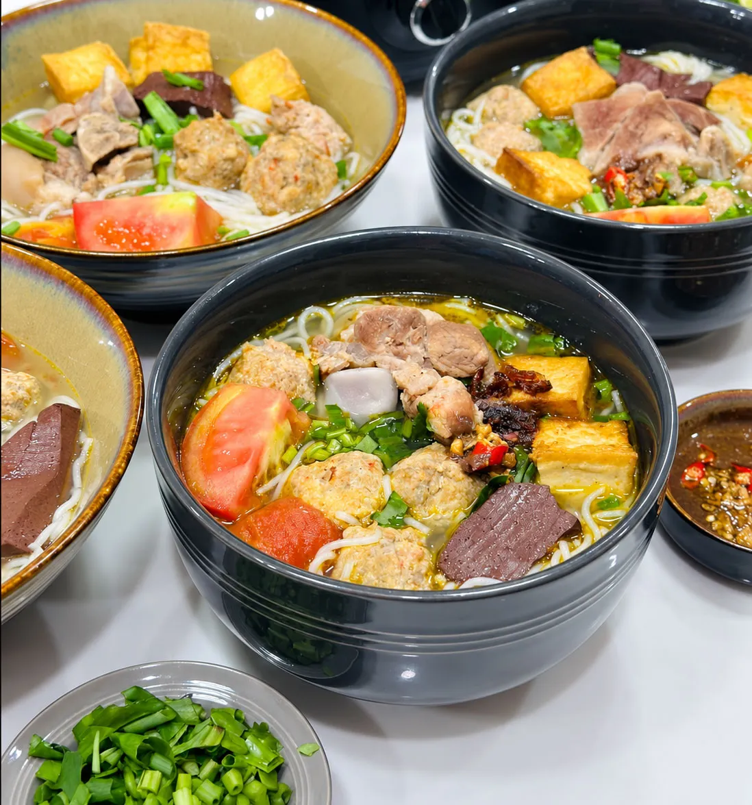 Bun Rieu for Beginners: What’s Inside the Bowl? 5 Tomatoes give bun rieu its light acidity, natural sweetness and signature orange-red color.