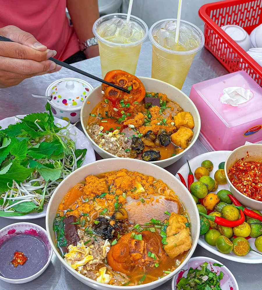 Bun Rieu for Beginners: What’s Inside the Bowl? 1 Vietnamese crab noodle soup enjoyed with shrimp paste, fresh herbs, a squeeze of lime, and then finished with a refreshing glass of iced tea.
