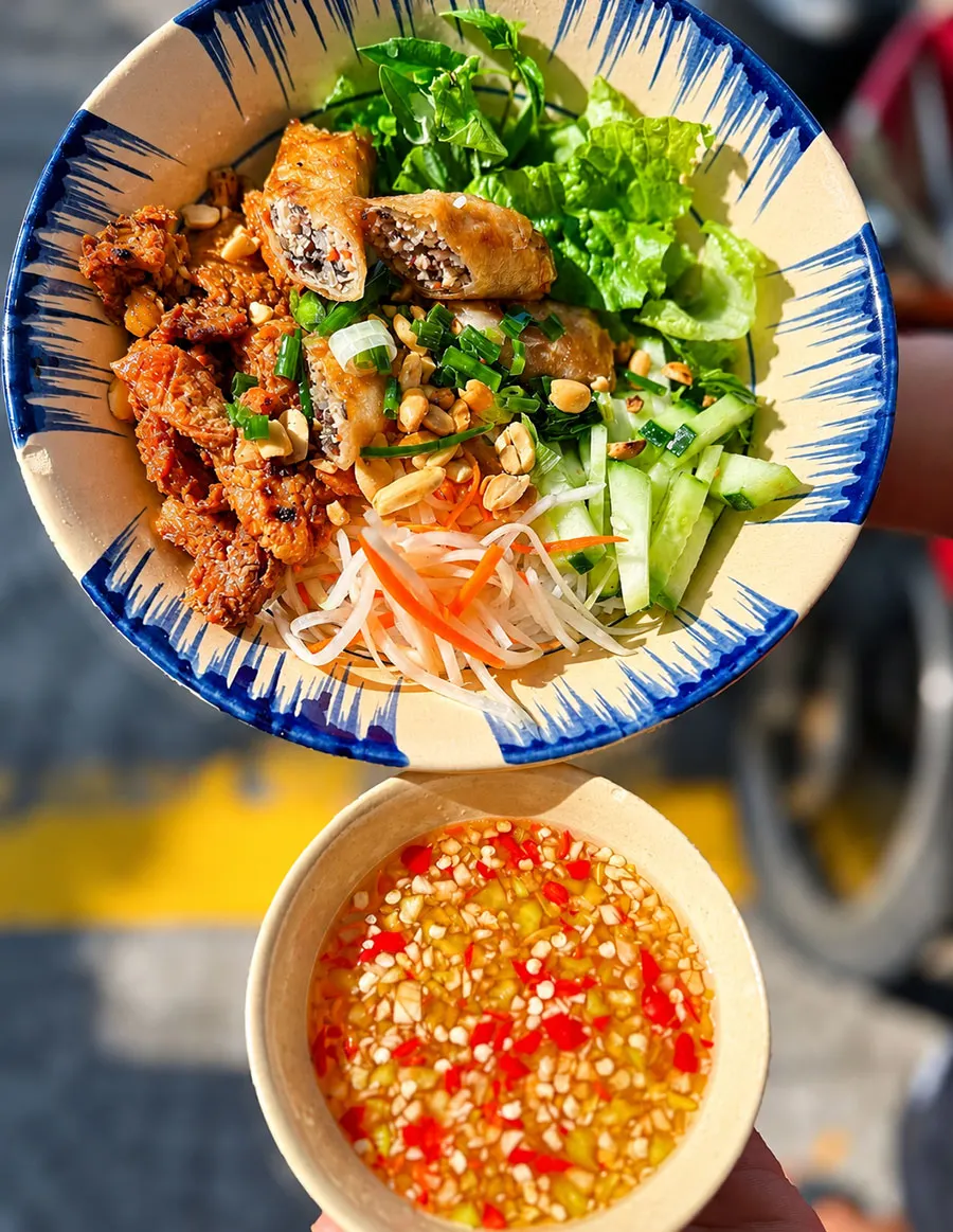 Bun Thit Nuong in Saigon: Where and How to Eat It 2 Vietnamese grilled pork noodle bowl with fresh herbs and vegetables