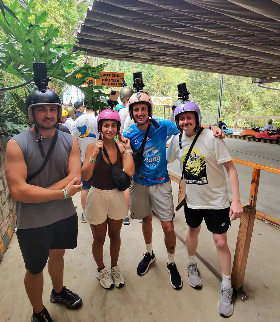 Dalat Wonderland: Is It Worth Visiting in 2026? 3 Happy tourists enjoying exciting adventures, ATV rides, sheep feeding and fun outdoor activities at Dalat Wonderland.