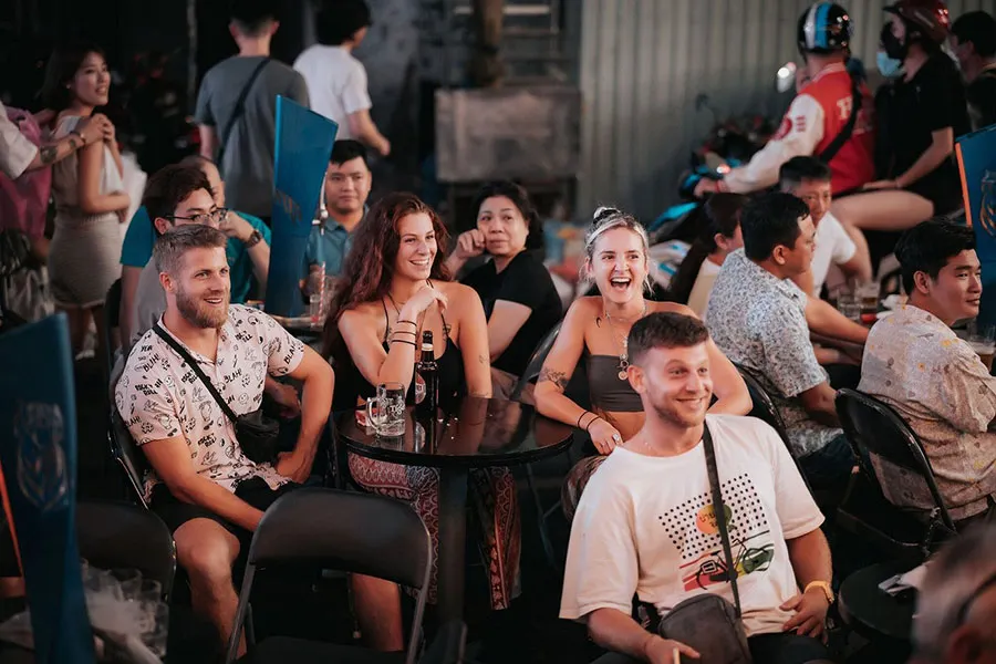 Live music in Ho Chi Minh City: Where to go beyond party bars 2 Travelers enjoying live music in Ho Chi Minh City at a small indoor venue