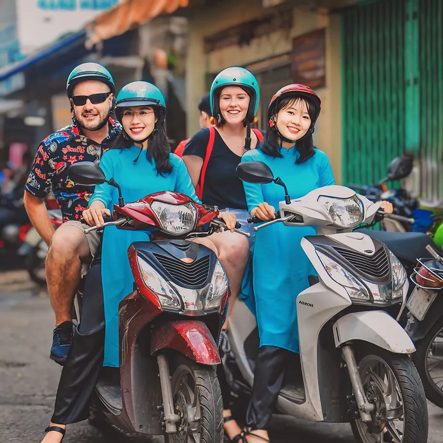 What to Wear on a Saigon Motorbike Food Tour 2 Saigon Adventure guests wearing casual outfits and helmets for a motorbike food tour