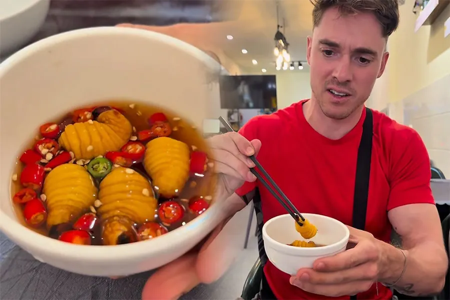 10 Strange Street Foods in Saigon That Surprise Foreign Tourists 3 Vietnamese coconut worm dish with fish sauce and spicy chilies