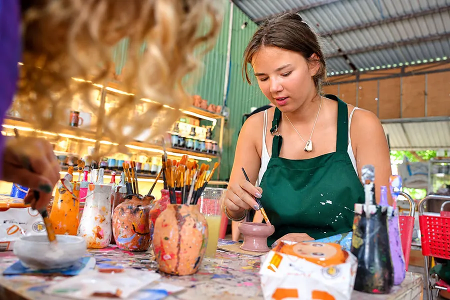 Thanh Ha Pottery Village: What to Expect from a Pottery Class 3 Visitors enjoying a hands-on pottery workshop at Thanh Ha Pottery Village