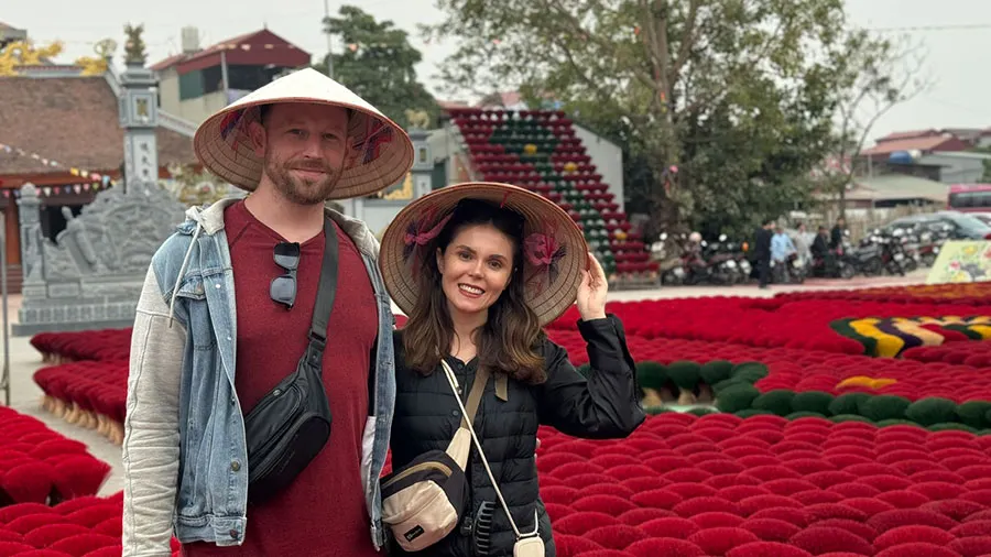 Inside a Vietnamese Craft Village: How Traditional Incense Is Made 3 Famous red incense displays arranged in large fans at Quang Phu Cau village