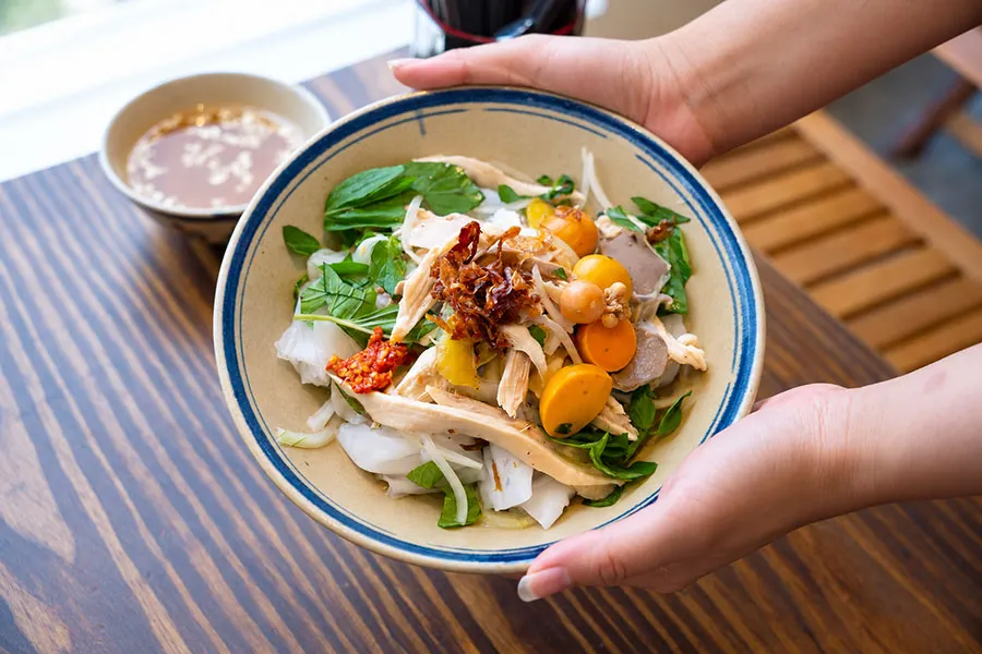 What to Eat in Dalat: Local Dishes Beyond the Night Market 5 Traditional Dalat bánh ướt lòng gà with tender chicken, steamed rice sheets and fresh herbs